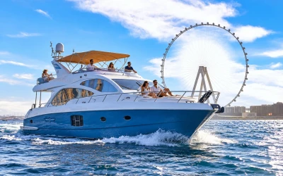 Guests enjoying a shared yacht tour in Dubai Marina with views of the Ain Dubai