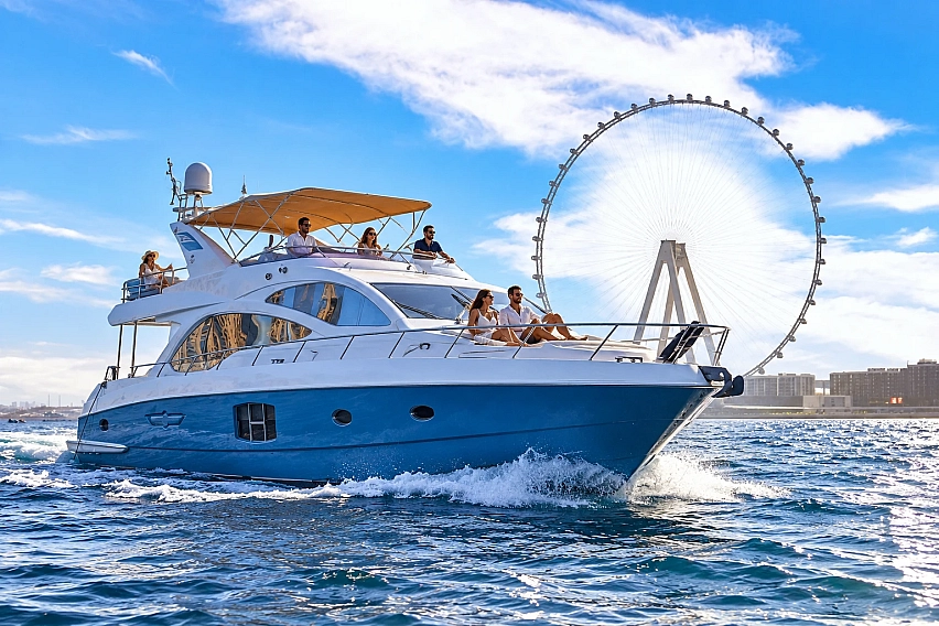 Guests enjoying a shared yacht tour in Dubai Marina with views of the Ain Dubai