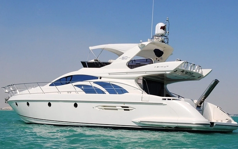 Private luxury yacht cruising through Dubai Marina