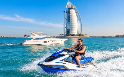 Jet ski rider enjoying a water adventure with Burj Al Arab in the background in Dubai