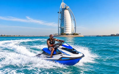Rider on a jet ski with a clear view of the Burj Al Arab from the sea